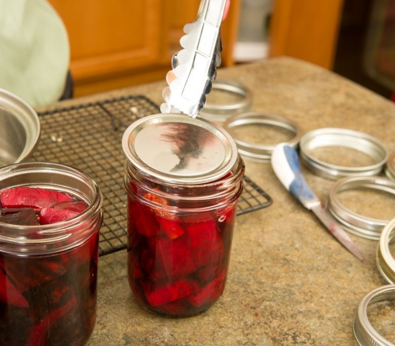 Lids being installed onto the jar | Water Bath Canning | Easy Step by Step Guide