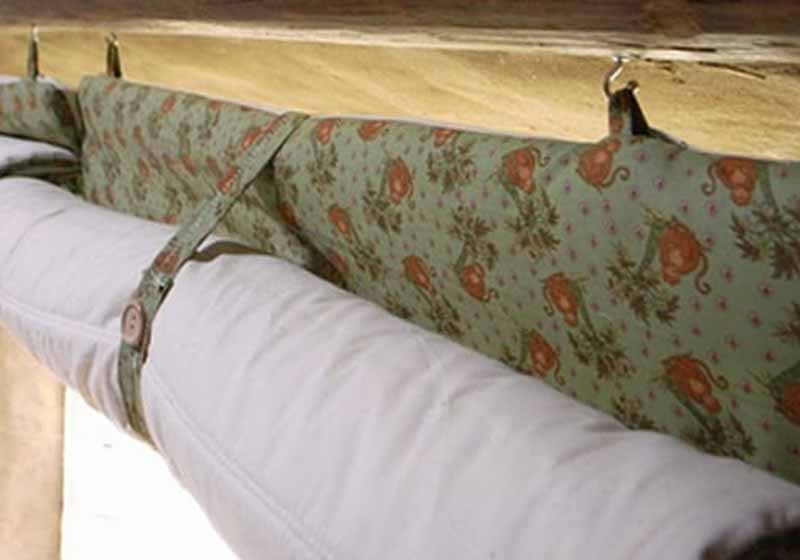 Use Old Quilts as Curtains to Help Keep the Heat Inside | how to stay warm in winter