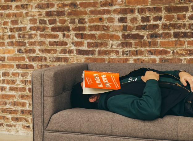 Person sleeping on sofa near the wall | Things To Do At Home During Winter For A Cozy Homestead