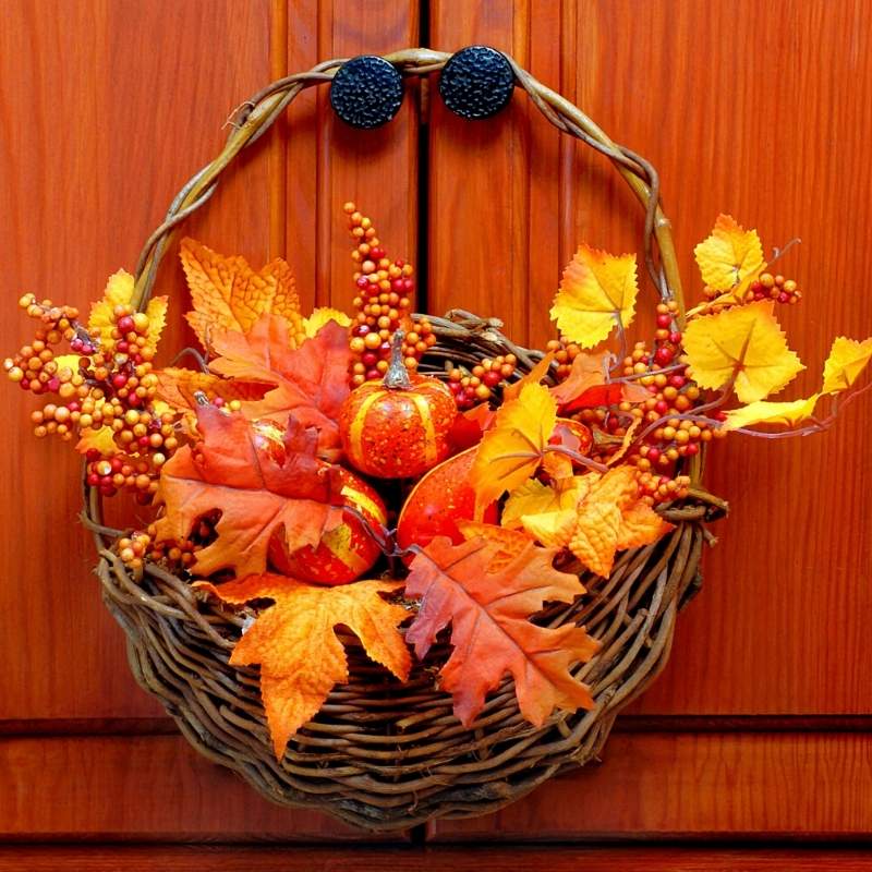 autumn fall decorative basket hanging on wooden door | fall season