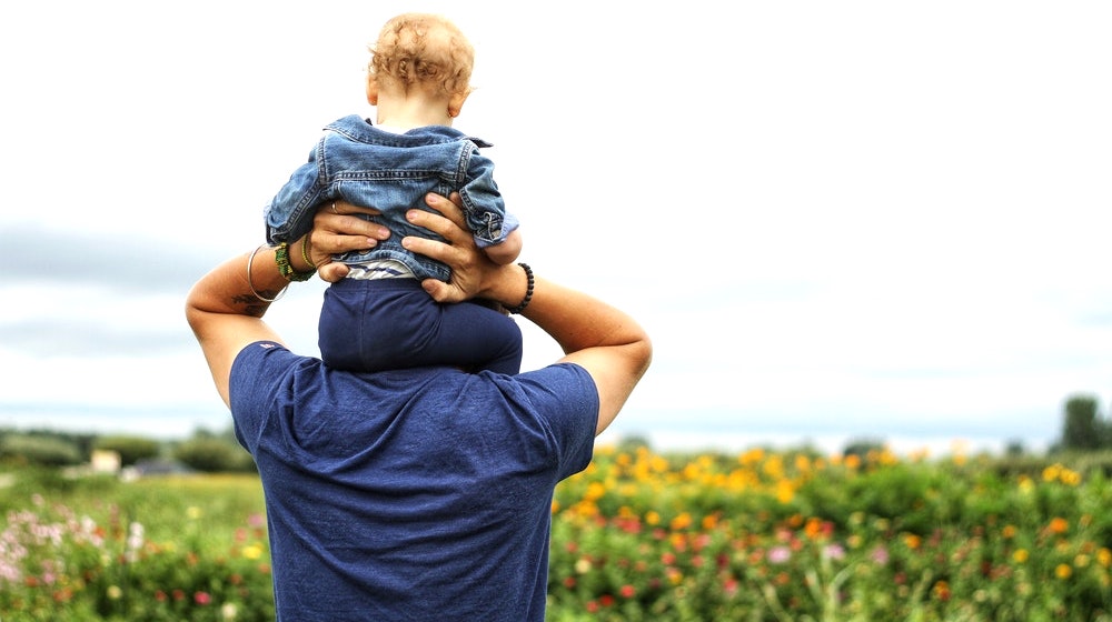Baby sitting on man's shoulder| Useful Gifts For A Dad Who Wants Nothing For Father's Day | personalized gifts | Featured