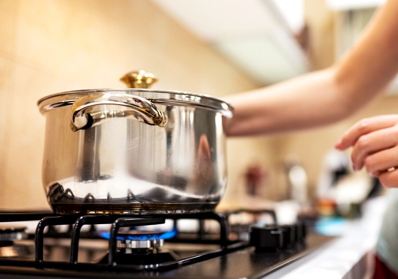 beautiful young woman housewife prepairing dinner | homemade bbq sauce easy