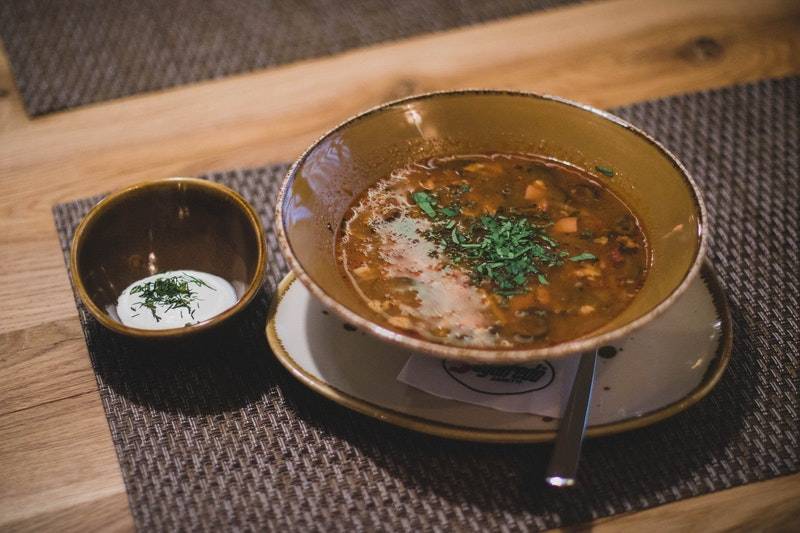 brown-ceramic-bowl-with-brown-soup | goat stew