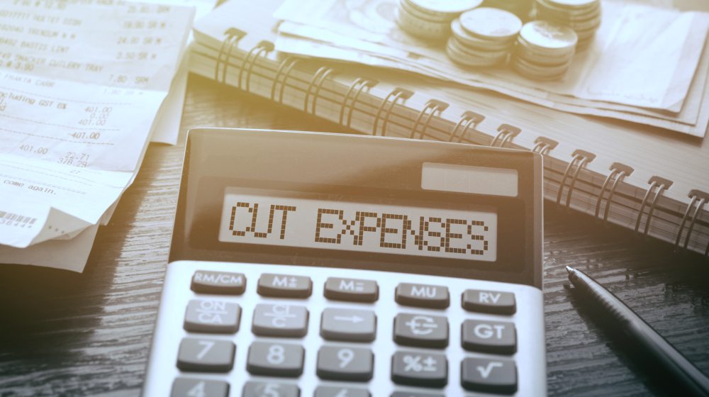 calculator with text cut expenses | How To Gain Financial Freedom While Homesteading | financial freedom