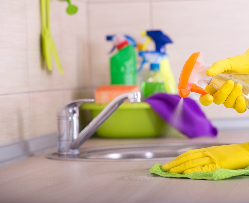 Spraying the countertop | Homesteading Ways To Use A Vinegar Cleaning Solution