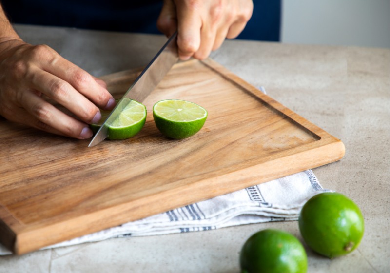 close hands cook cutting lime on | tonic syrup recipe