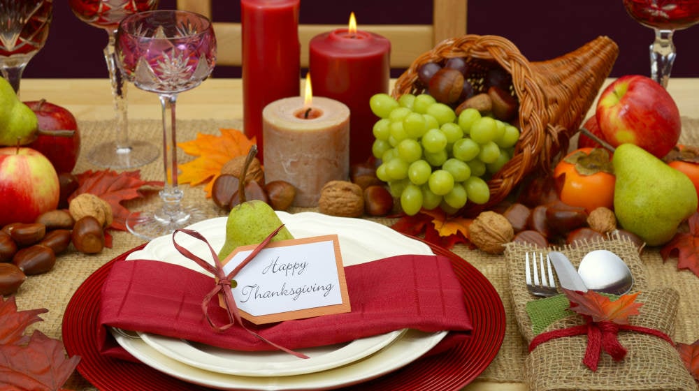 Country style rustic Thanksgiving table with place setting, cornucopia, candles and Autumn fruit centerpiece | Thanksgiving Table Ideas | This Is Everything You Need For A Perfect Thanksgiving Day | thanksgiving table setting ideas | Featured