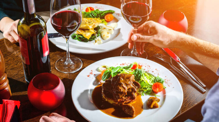 Couple having romantic dinner in a restaurant in rays of the sun | Dinner Ideas For Two | Recipes Fit For A Couple | Easy dinner ideas for two | Featured