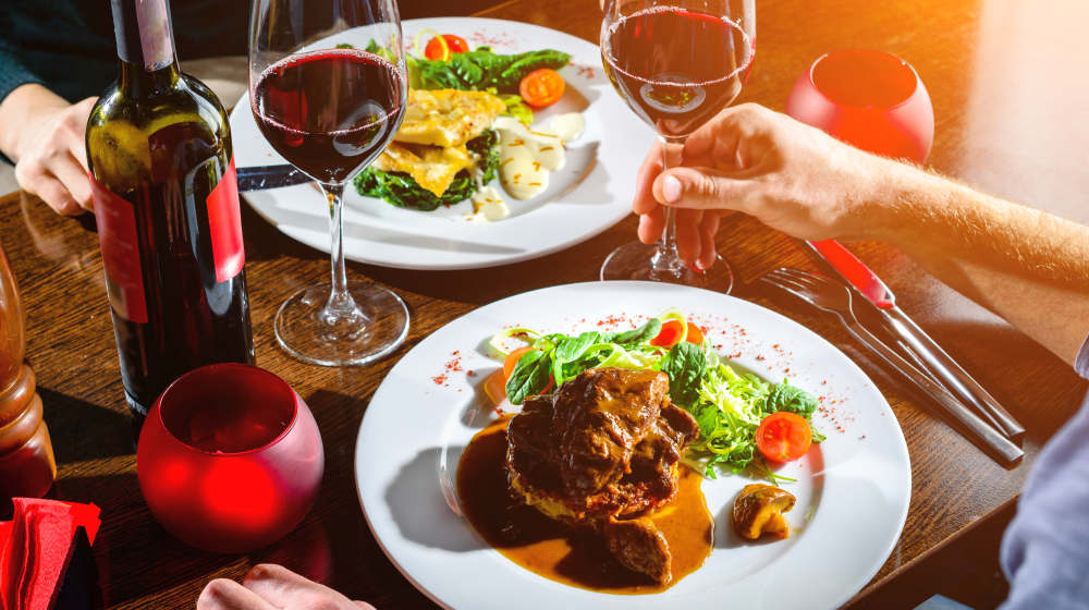 Couple having romantic dinner in a restaurant in rays of the sun | Dinner Ideas For Two | Recipes Fit For A Couple | Easy dinner ideas for two | Featured