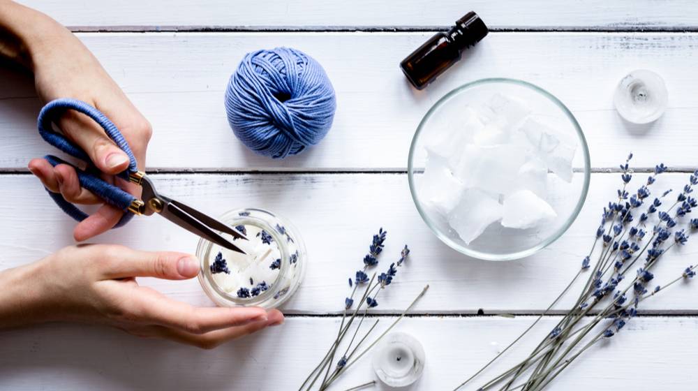 handmade-candles-lavender-on-wooden-background | Stress Relieving Lavender Candles You Can Make At Home | Featured