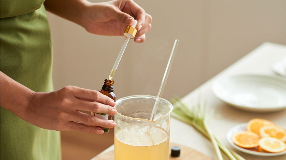 hands woman adding essential oil into | Amazing Uses For Glycerin | featured