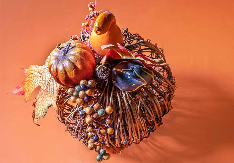 harvest center piece on orange background | thanksgiving table decor