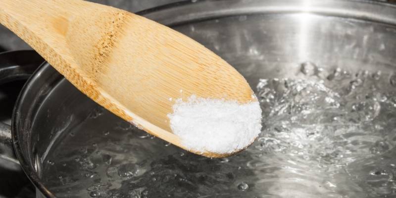 pouring salt into the boiling water | salted eggs