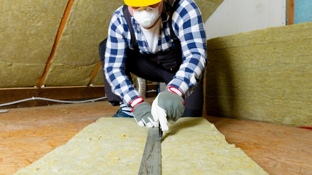 man installing thermal roof insulation layer | Winterizing Your Home 101 | Prepare For Winter Months To Come | winterizing your home