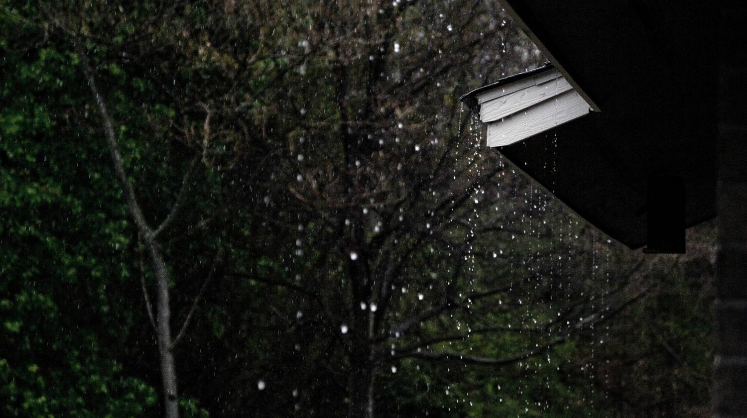 Featured | Rain dropping from roof | DIY Rainwater Collection System for Homesteaders
