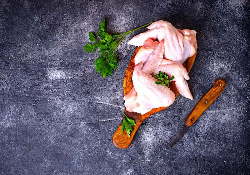 Raw Chicken Wings Chopping Board | A Step-by-Step Guide To Canning Chicken Safely At Home