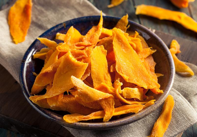 raw organic dried mangos bowl | dehydrating fruit times and temperatures