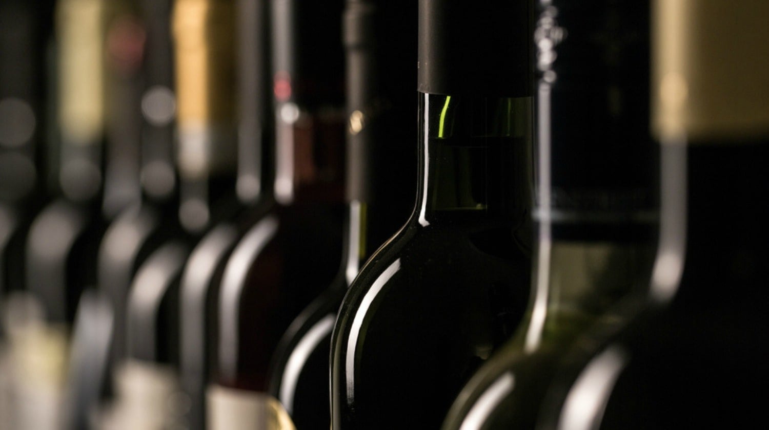 Featured | Row of vintage wine bottles in a wine cellar | Fun Pallet Project - Homemade Wine Rack