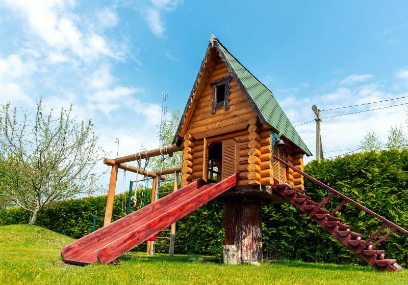 small wood log playhouse hut stairs | cool treehouse ideas