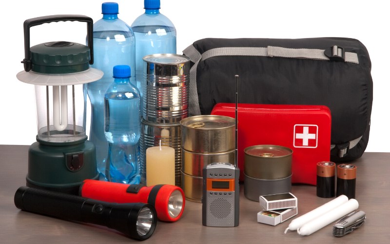 survival kit on wooden table | winter storm warning