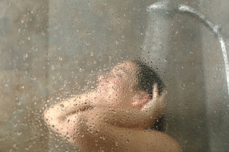 unfocused-portrait-woman-showering-through-bath | How To Get Rid Of Chiggers Naturally: The Ways and Whys