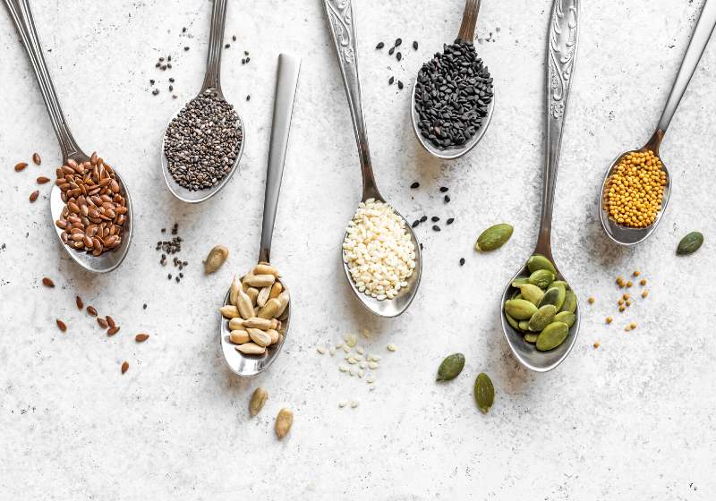 various seeds assortment on white background | plant based diet recipes