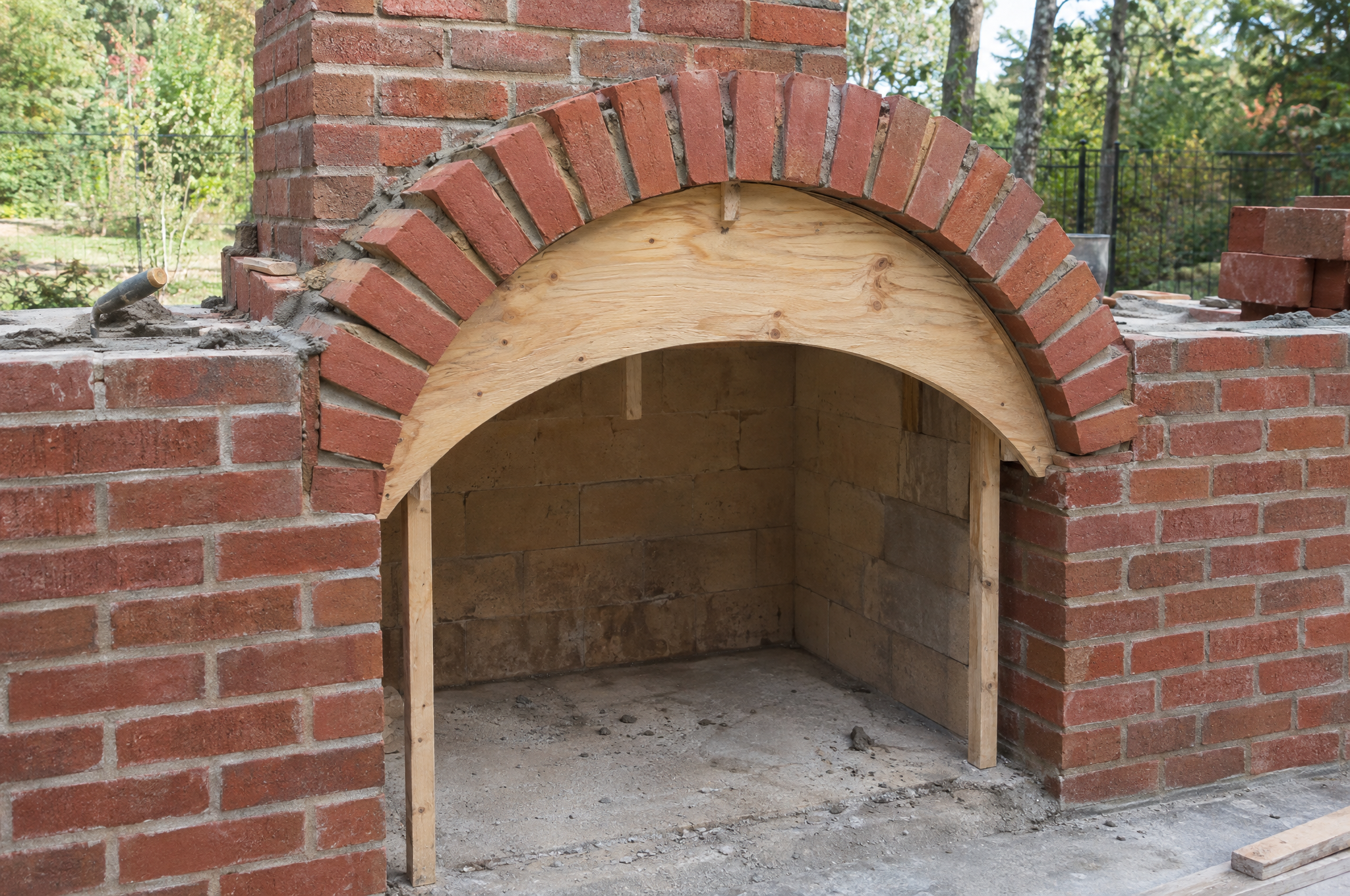 Brick arch built over a plywood form at the fireplace opening